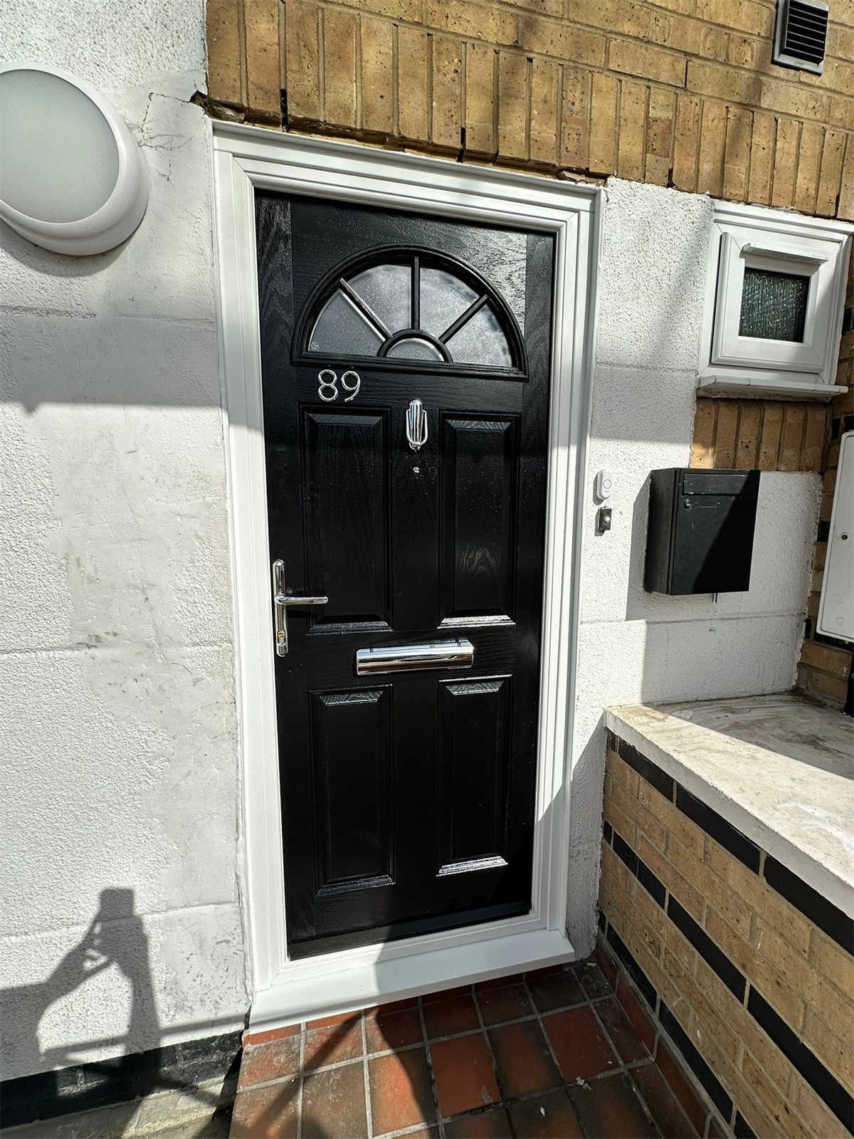 Black composite door with fanlight glass, London, fitted by Termopane Windows