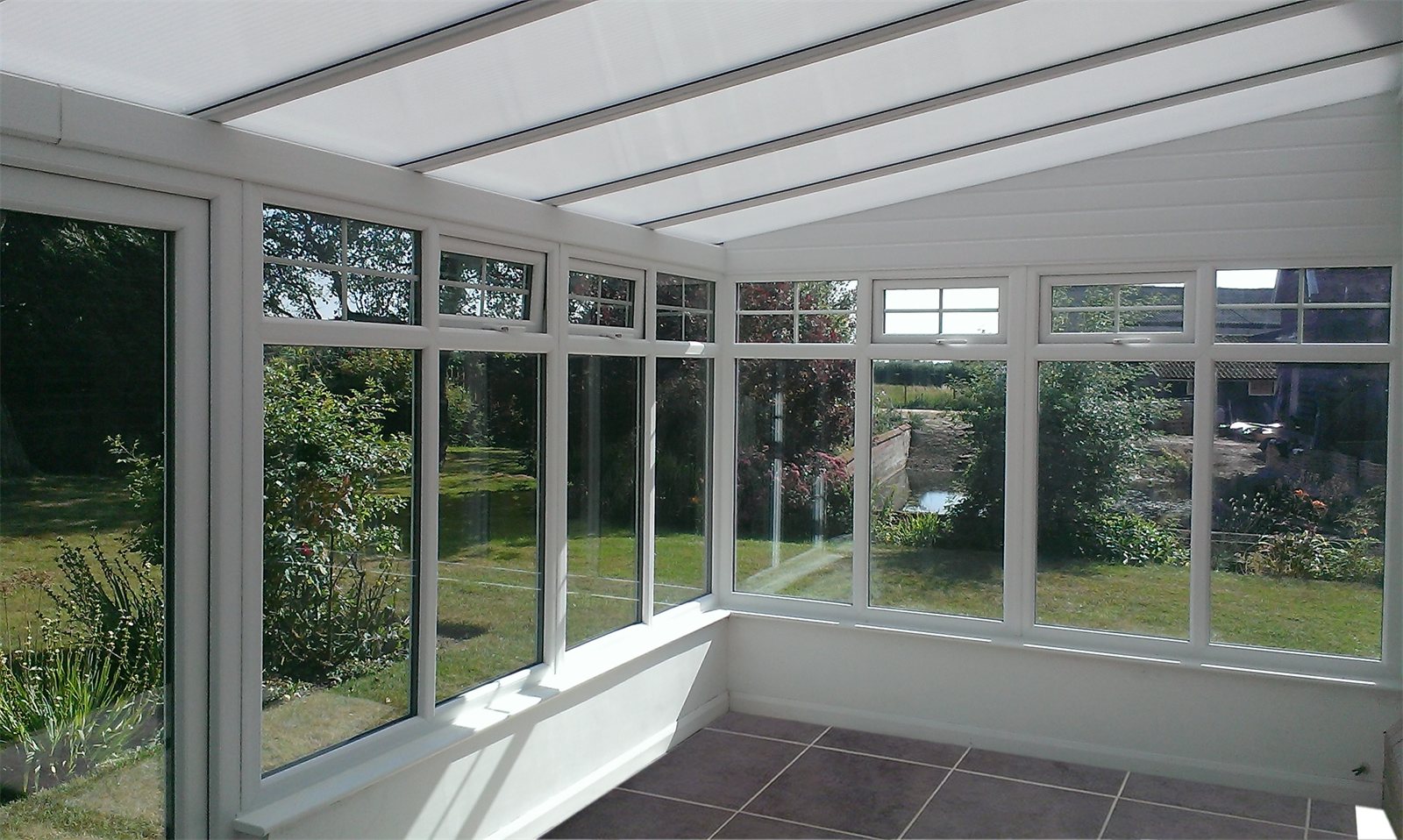 Inside a lean-to conservatory with a solid roof (product photo)