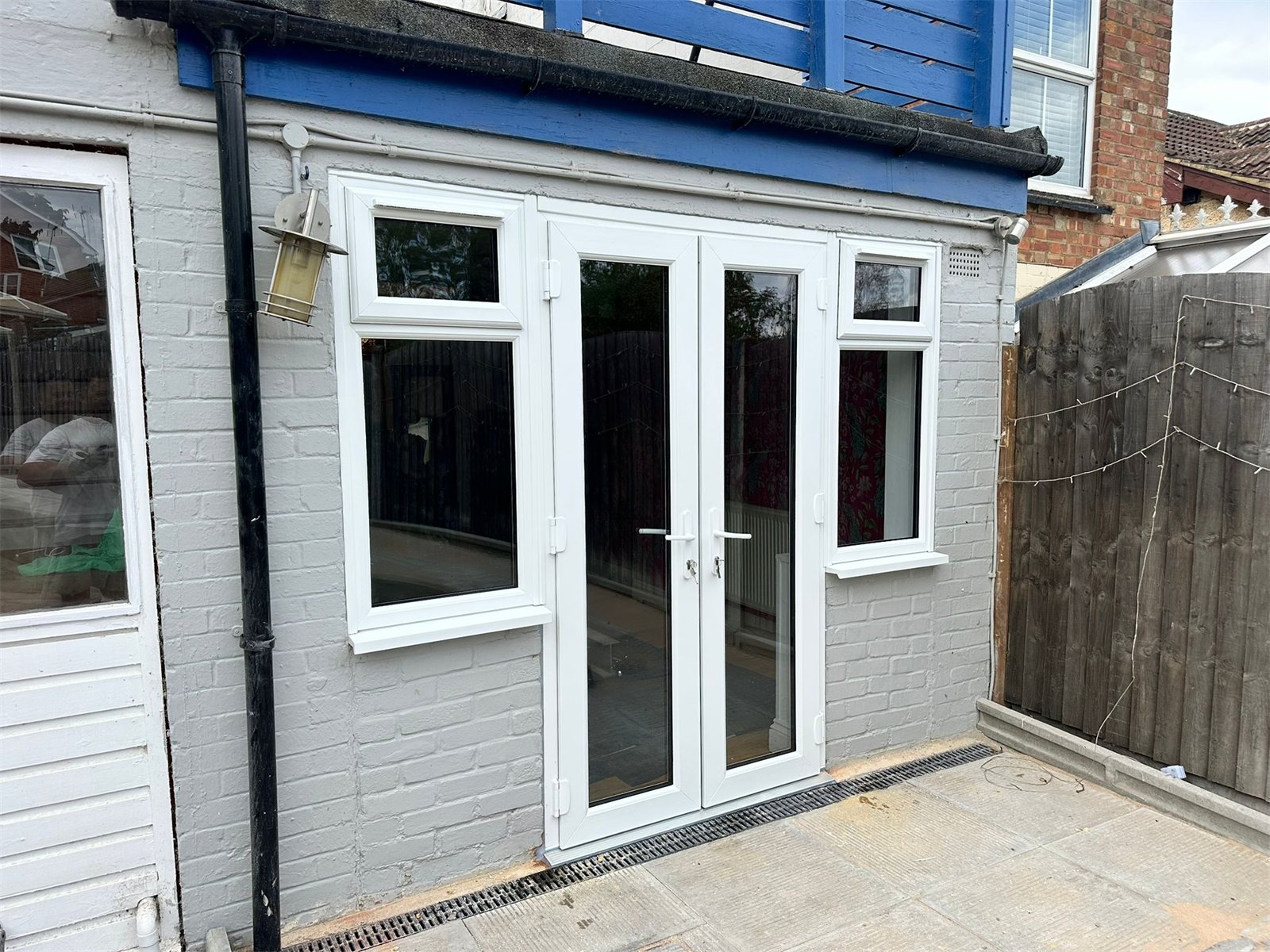 White uPVC French doors with side windows, fitted by Termopane Windows