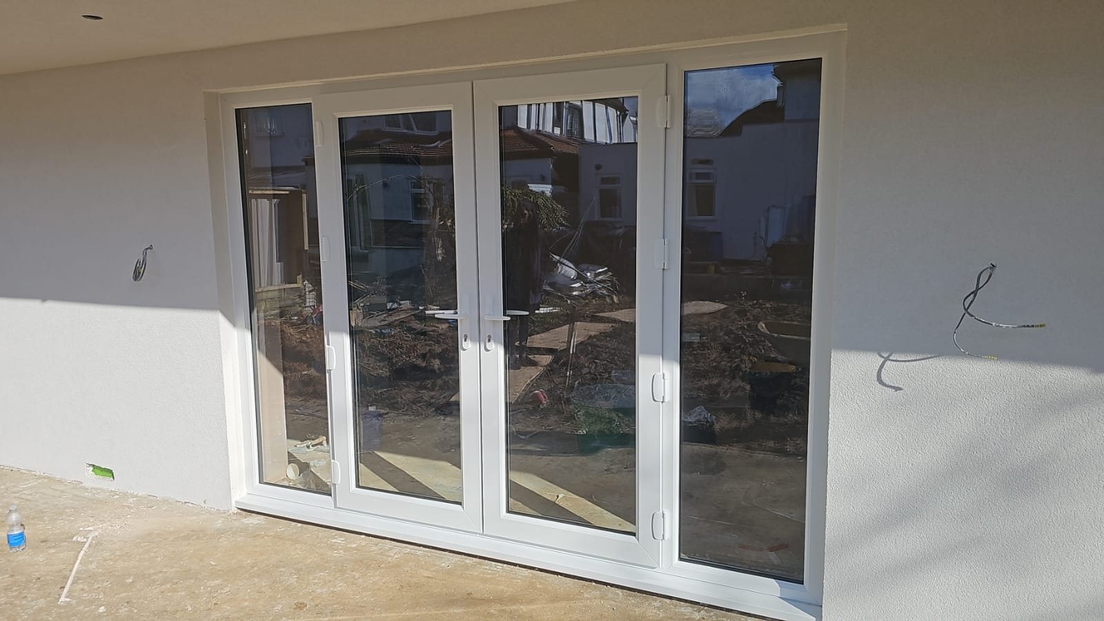 White uPVC French doors with fixed side panels, fitted by Termopane Windows