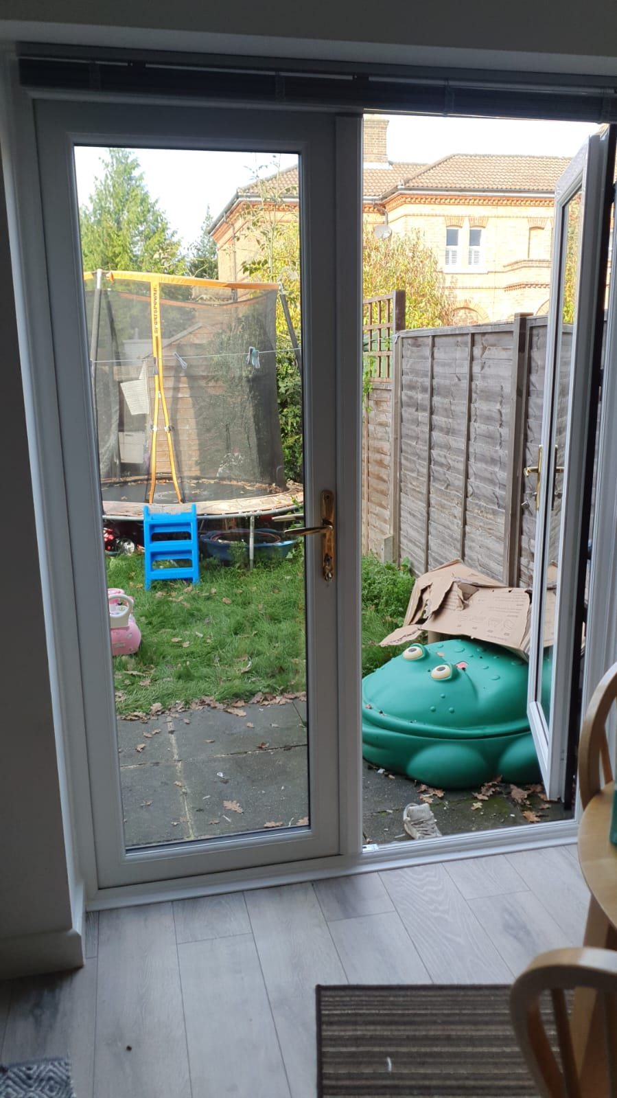 White uPVC French doors onto a garden, inside view, fitted by Termopane Windows