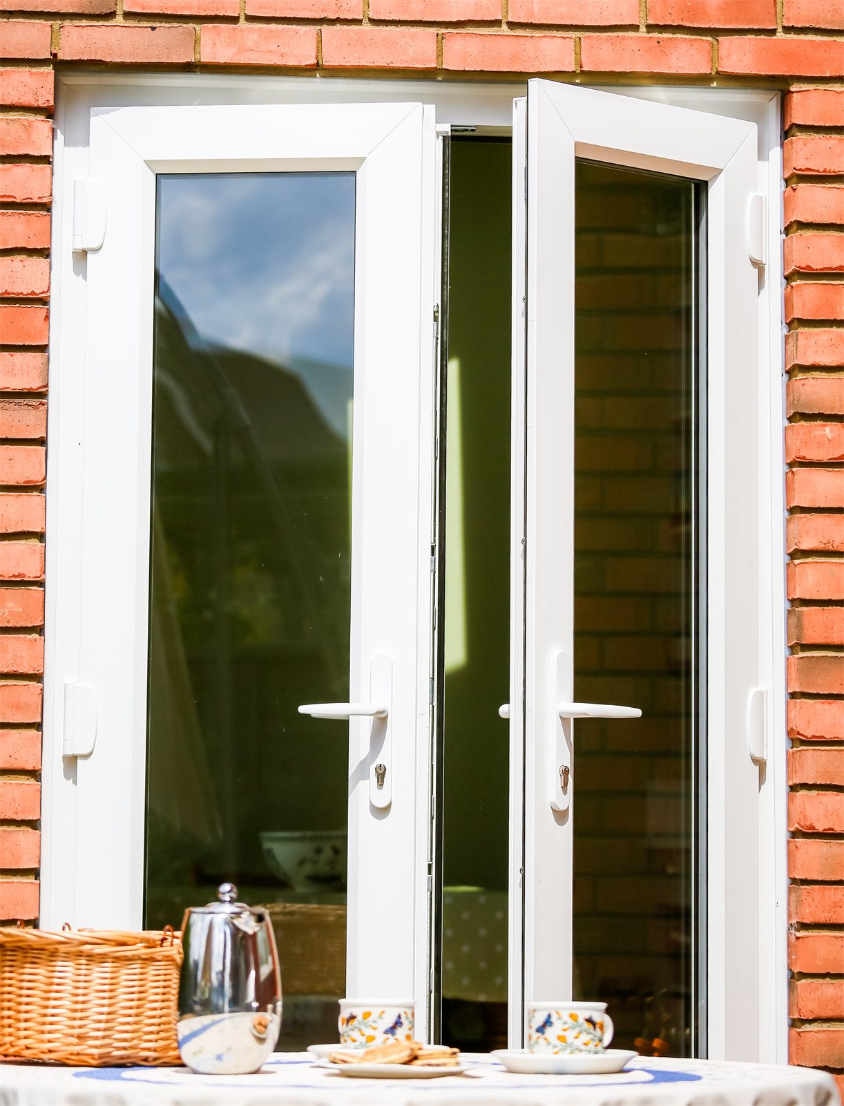 White uPVC French doors, opened (product photo)