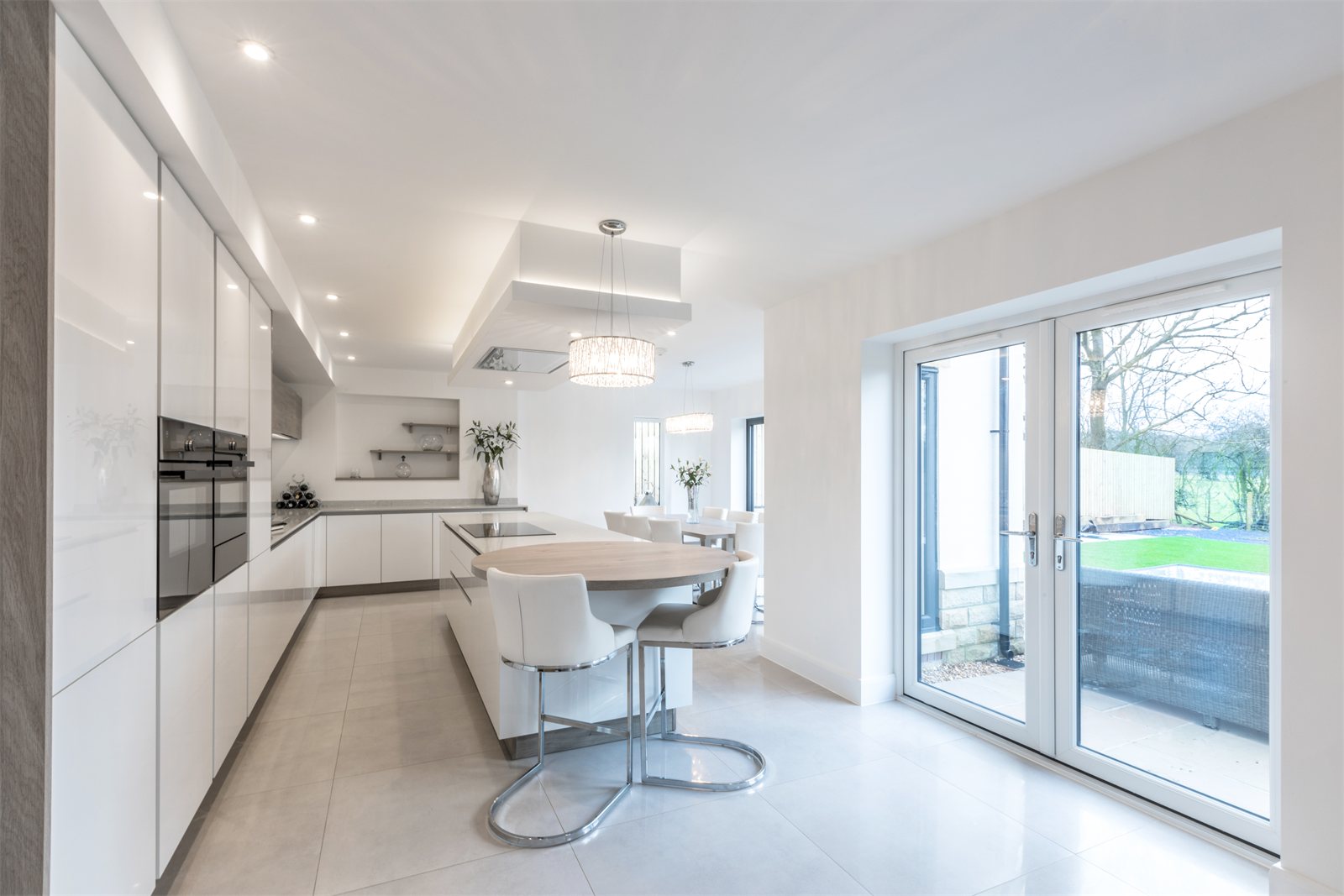 White uPVC French doors in an open-plan kitchen (product photo)