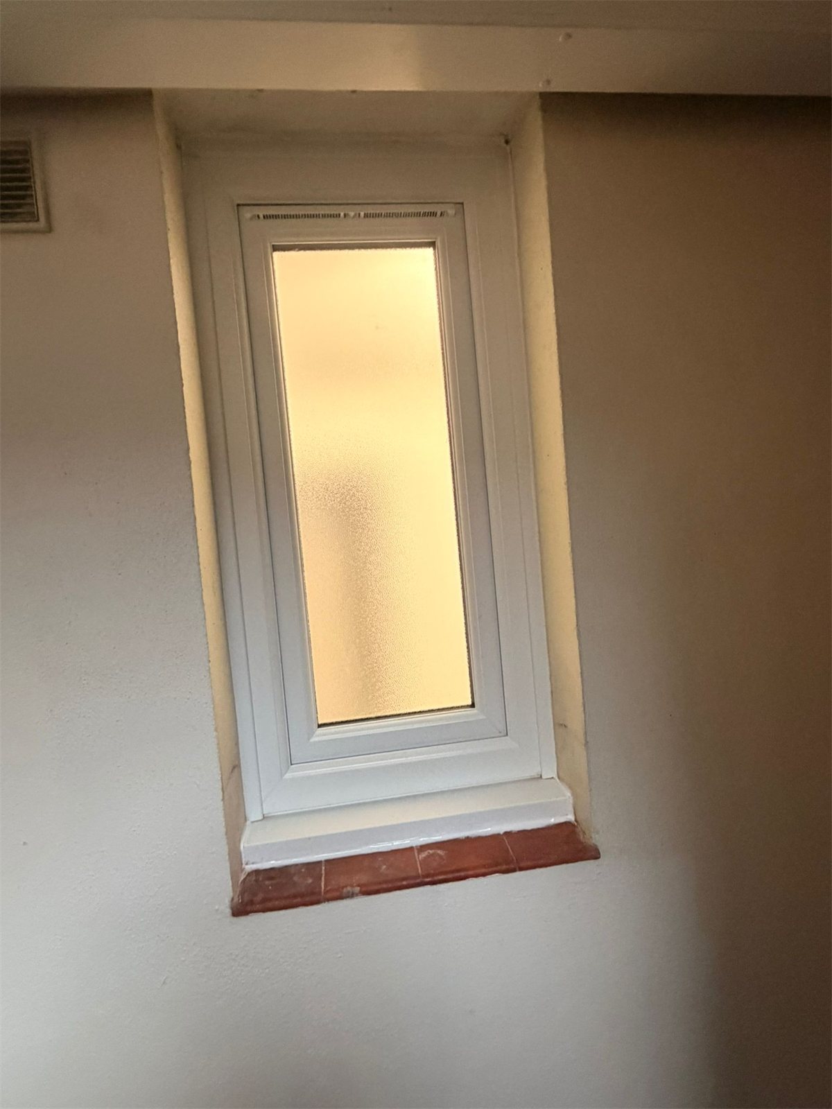 Tall tilt and turn window with obscure glass, London, fitted by Termopane Windows