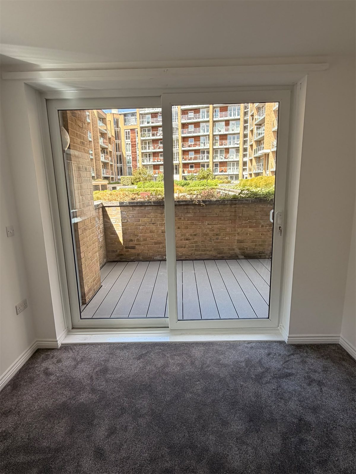 White Liniar uPVC sliding patio door onto a balcony, London, fitted by Termopane Windows