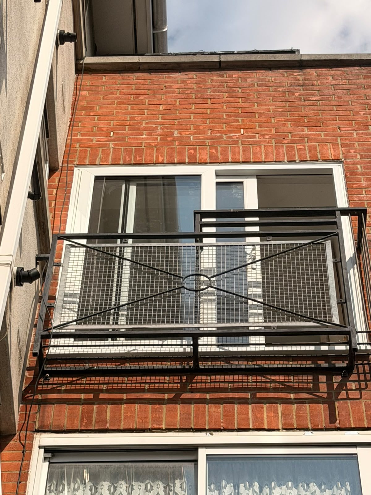 uPVC sliding door behind a Juliet balcony, London, fitted by Termopane Windows