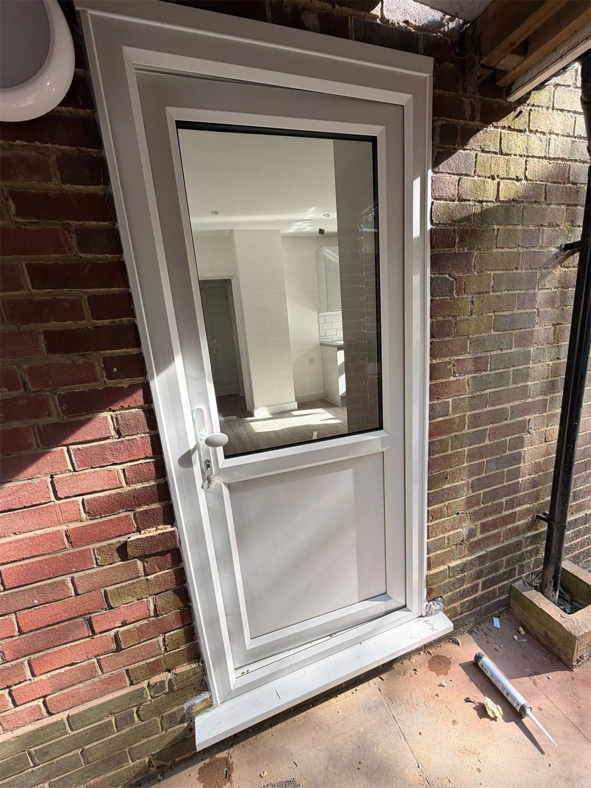 Half-glazed white uPVC back door, London, fitted by Termopane Windows