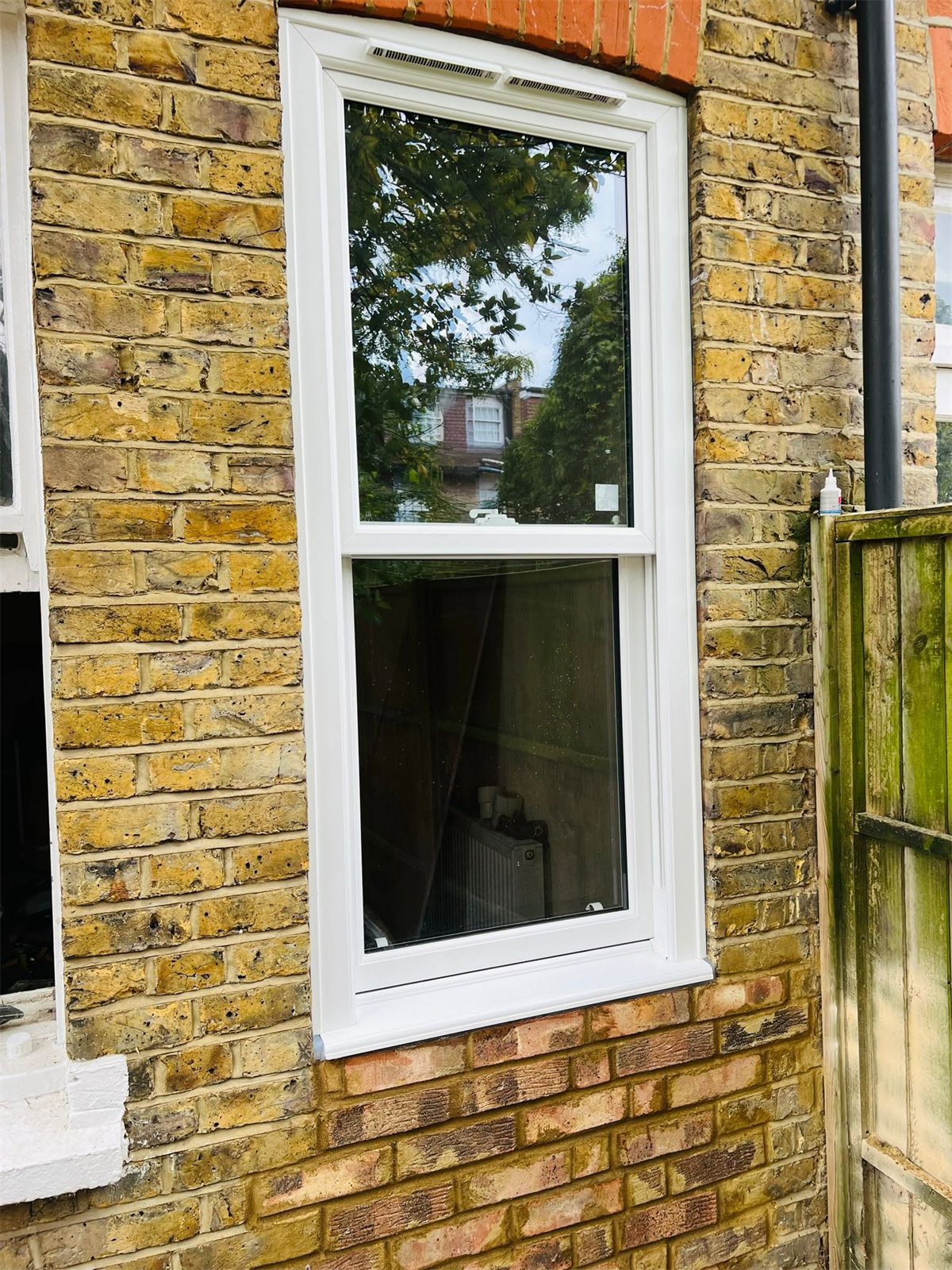 Tall vertical sliding sash window in London stock brick, London, fitted by Termopane Windows