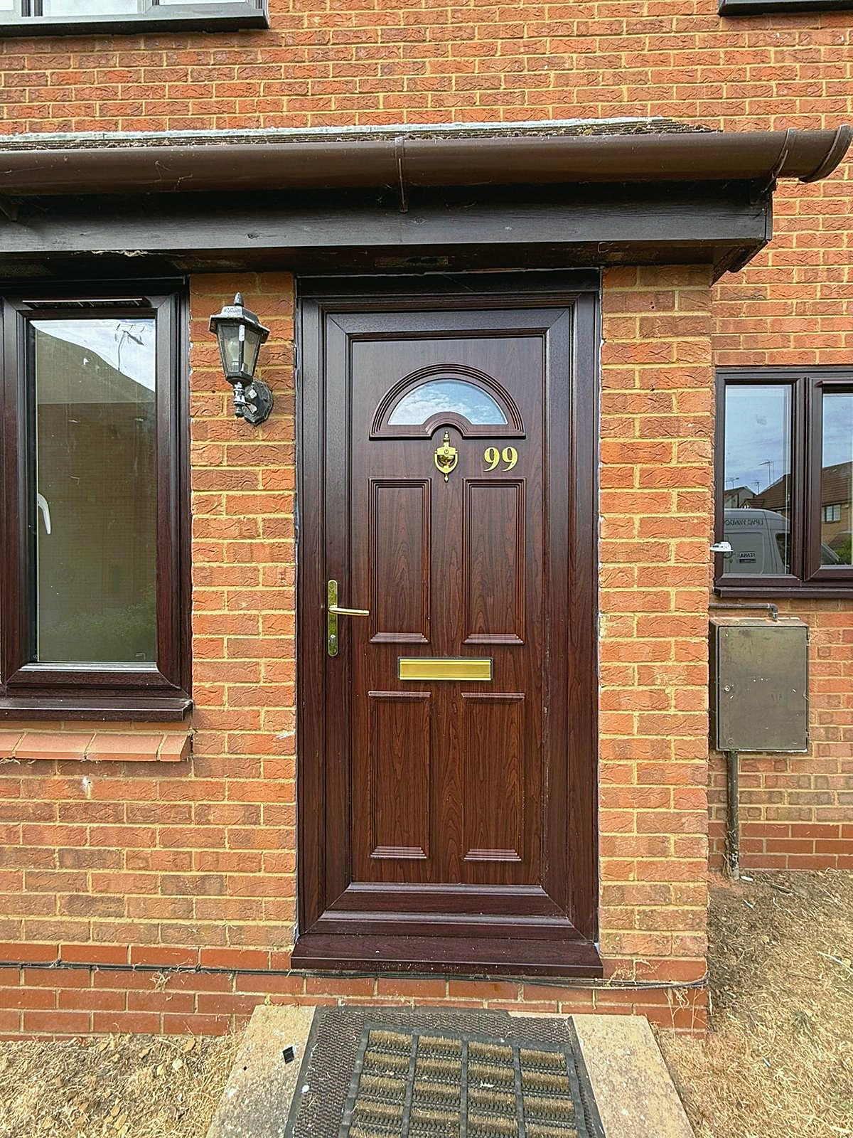 Woodgrain uPVC front door with matching window, London, fitted by Termopane Windows